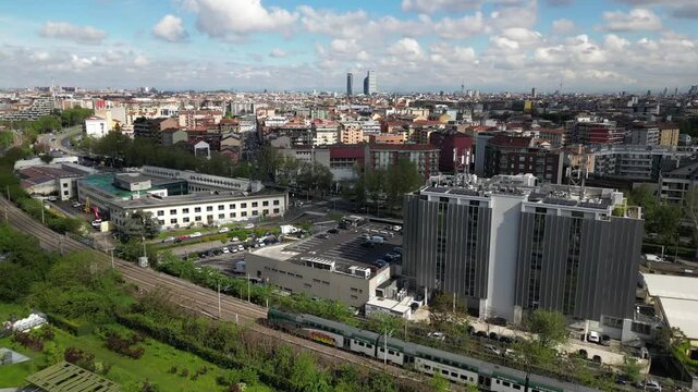 EUROPE, ITALY, MILAN 09,23,2025  NTT DATA and Loreal new building headquarter skyscrapers in downtown of Milan - Drone aerial view of skyline with new modern area and new companies in  Romolo district
