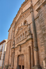 Facade and bell tower of the majestic Church of the Assumption in Cretas, Teruel, a sublime example...