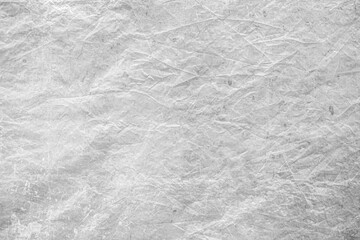 wrinkled white paper texture, high-resolution background suitable for design mockups, overlays, and creative projects.