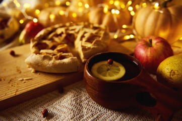 Cozy Autumn Thanksgiving Table Scene With Bread, Fruit, and Warm Luminescent Holiday Lights