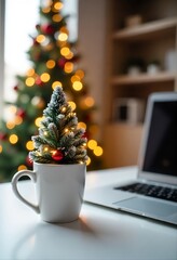 Flocked mini Christmas tree in ceramic mug with laptop and holiday bokeh background