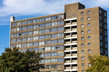 Fototapeta premium Tall Residential Apartment Building with Rows of Windows in Amsterdam