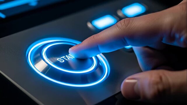 Hand Pressing Futuristic Start Button - Close-up shot of a hand pressing a glowing blue futuristic start button. The button is metallic with a bright blue aura, suggesting advanced technology.