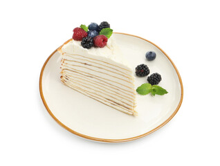 Piece of tasty crepe cake with berries and mint isolated on white