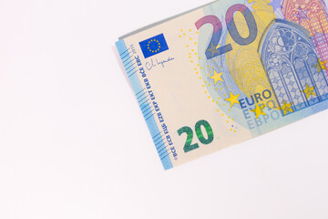 Close-up of a 20 euro banknote on a white background, representing money, finance, savings, currency, or economic value.