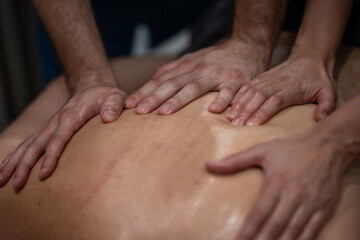 Fototapeta premium Therapeutic four hands massage for deep relaxation and healing