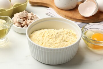 Making cornbread. Different ingredients on white marble table, closeup