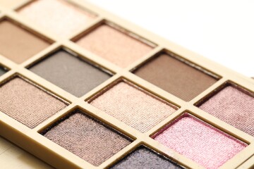 Beautiful eyeshadow palette on white background, closeup