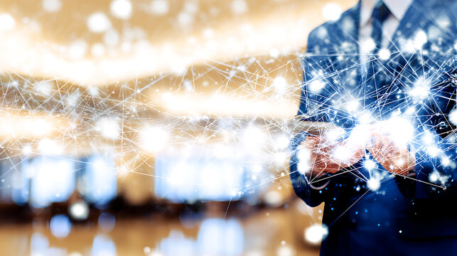 Business professional holding a glowing digital network, symbolizing connectivity and technology in a modern office environment.