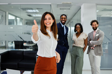 Smiling business team in office showing positivity, success, and motivation together
