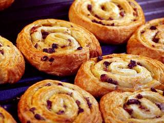 A Close-Up of Freshly Baked Sweet Swirl Buns with Raisins