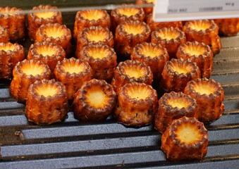 Close-Up of Traditional French Mini Cakes with a Caramelized Crust - A beautiful display of freshly baked canelés