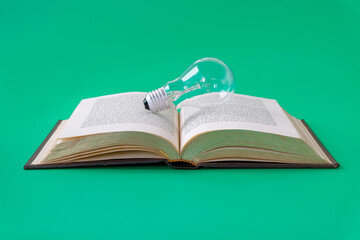 Light bulb on an old book background.Education concept.