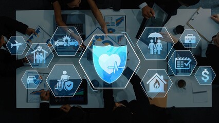 A top-down view of a business meeting with digital healthcare icons representing insurance, wellness, and medical services, illustrating collaboration and strategic planning. Raster