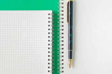 Top view of Fountain pen on book note .
