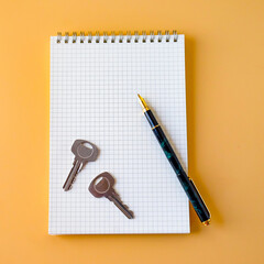 Top view of Fountain pen on book note and key .