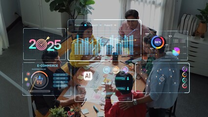 A business team collaborates in a modern office, examining e-commerce data and future projections for 2025, utilizing advanced visual displays for effective strategy planning. Raster