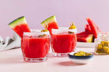 Hot watermelon jalapeno cocktail in glasses on table
