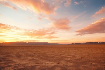 Fototapeta premium Golden desert plain under a vibrant sunset sky sand