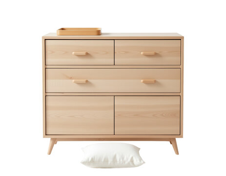 Modern wooden dresser with drawers and decorative pillow on floor