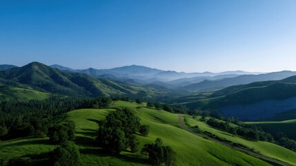 Obraz premium Expansive Rolling Hills Adorned Under Clear Blue Sky
