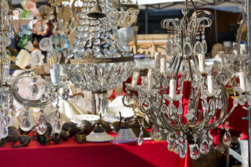 VINTAGE CRYSTAL CHANDELIERS AT FLEA MARKET SYMBOLIZE ELEGANCE AND LUXURY - Antique lighting, ornate design, sparkling glass, classic decor - Flea market for selling second hand products