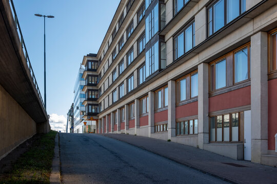 Concrete alignment between urban blocks in Stockholm, perspective corridor expressing minimalist Scandinavian architecture, geometric rhythm and depth for design composition