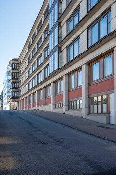 Linear fa&ccedil;ade with rhythm of windows and shadows in Stockholm, contemporary Scandinavian architecture highlighting perspective, repetition and composition for modern design uses