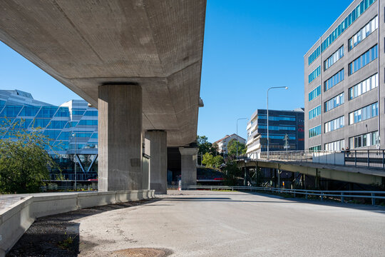 Elevated concrete structure and modern office buildings in Stockholm, urban composition showing geometry, circulation and contemporary Scandinavian architecture for design concepts