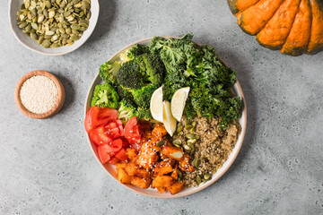 Vibrant vegan buddha bowl with quinoa, roasted vegetables, and fresh greens. Vegetable recipes.