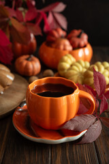 Autumn Composition with Pumpkin Mug, Bundt Cake and Seasonal Decor
