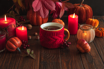 Cozy Autumn Scene with Mulled Wine, Candles, Pumpkins and Seasonal Decor