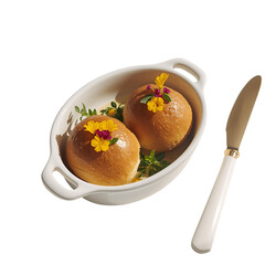 Two baked apples with edible flowers in a dish isolated on transparent background