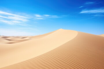 Golden sand dunes under vast blue sky with wispy clouds desert landscape