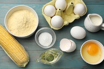 Cornbread preparation. Different ingredients on light blue wooden table, flat lay