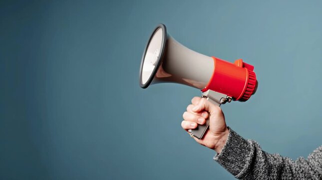 Hand Megaphone Announcement Communication Loudspeaker Blue Background Message Alert Expression Hand Holding Megaphone Against Blue Background Symbolizing Communication Announcement Spreading