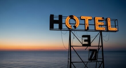 Vintage hotel neon sign at sunset over calm sea. Retro 80s-90s motel signage. Nostalgic travel concept with glowing orange letters. Melancholic vhs-style seaside view.