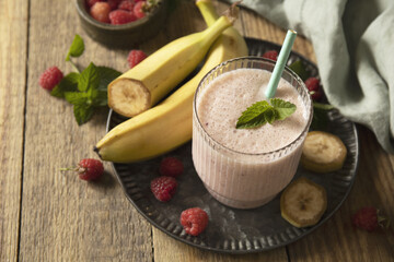Refreshing banana raspberry smoothie with fresh mint for healthy living and summer enjoyment