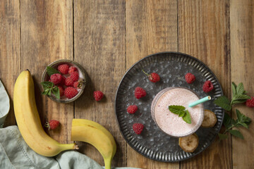 Refreshing banana raspberry smoothie with fresh mint for healthy living and summer enjoyment.