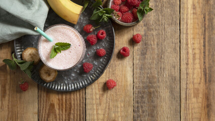 Refreshing banana raspberry smoothie with fresh mint for healthy living and summer enjoyment.