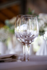beautiful table setting with flowers and cutlery on wooden table at wedding or dinner. stylish tablewear decorations	