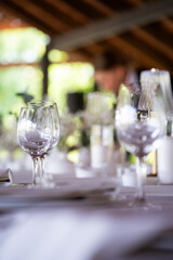 beautiful table setting with flowers and cutlery on wooden table at wedding or dinner. stylish tablewear decorations	
