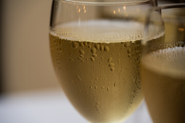 Elegant champagne glasses filled with sparkling wine on a festive celebration table, close up view of luxury drink serving for wedding banquet, party toast, event catering and reception ceremony