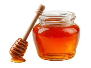 A jar of honey with a wooden spoon sticking out of it