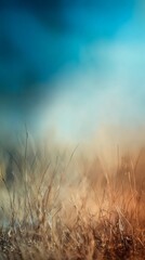 Obraz premium Serene abstract nature scene showcasing a gentle field of grass beneath a bright blue sky, designed for inspiring creative projects that require peaceful, calming visuals capturing the essence of