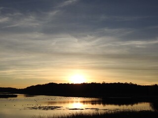 Tranquil scene, sunset over the wetlands of the Bombay Hook National Wildlife Refuge, Kent County, Delaware.