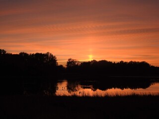 Obraz premium Once the sun has set, peace and calmness, can be felt, during cilvil twilight, as the last light of day colors the sky. Bombay Hook National Wildlife Refuge, Kent County, Delaware.
