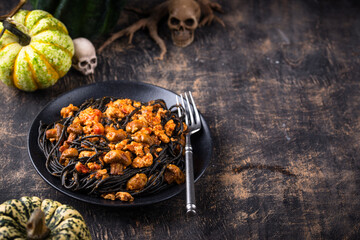 Halloween dish black pasta with bolognese