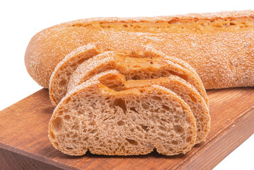 Buckwheat bread sliced on a wooden board. Baguette isolated on white.