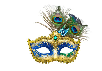 Ornate blue and gold venetian mask adorned with peacock feathers and embellishments, set against a stark black background.